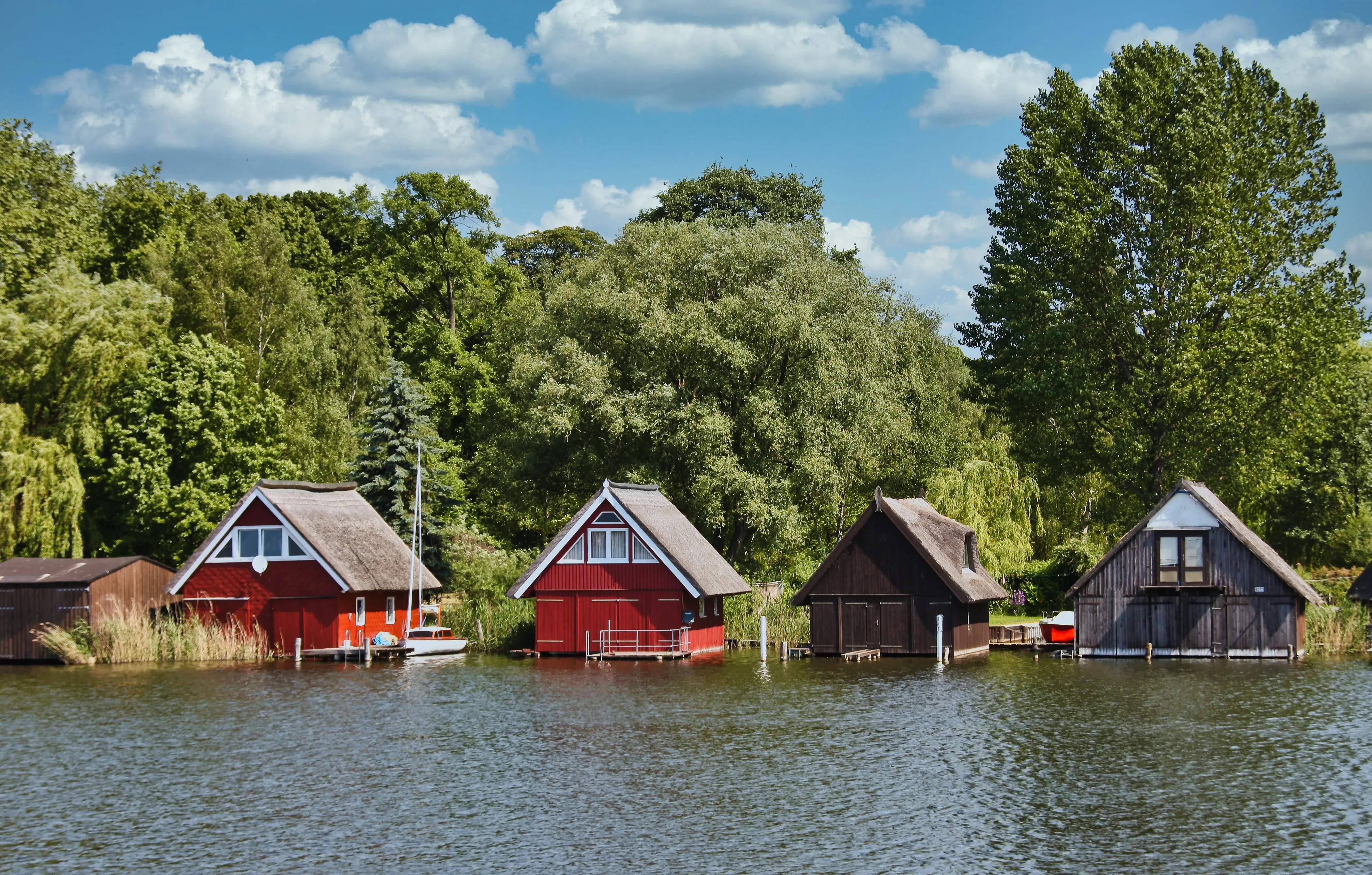 Wooden boathouses in Mueritz National Park, Mecklenburg Lake District,Germany. Mecklenburg-Vorpommern, Germany.