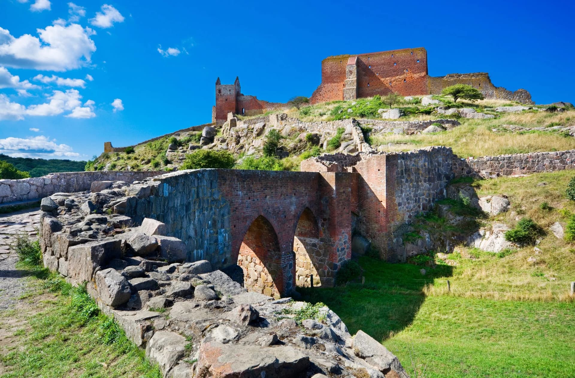 Hammershus castle - the biggest Northern Europe castle ruins situated at steep granite cliff on the Baltic Sea coast, Bornholm, Denmark